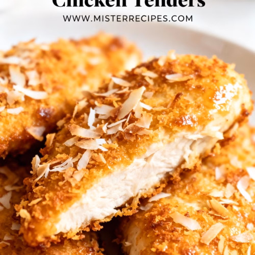 image of a beautifully arranged flat lay of ingredients for baked coconut crusted chicken tenders showcasing chicken tenderloins shredded coconut flour eggs panko breadcrumbs garlic powder onion powder paprika salt and pepper on a rustic wooden board with fresh lime wedges and a sprig of cilantro ready for preparation natural lighting food photography realistic and vibrant colors