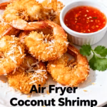 image of a flat lay shot of the ingredients for air fryer coconut shrimp including shrimp shredded coconut flour eggs panko breadcrumbs and a sweet chili dipping sauce arranged artfully on a rustic wooden board with some fresh lime wedges and cilantro garnishing the scene