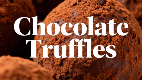 image of a beautifully Easy Chocolate Truffles arranged flat lay of chocolate, heavy cream, cocoa powder, butter, and vanilla extract on a rustic wooden surface in natural light