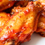 image of a chaotic aerial flat lay of ingredients for Korean gochujang chicken wings including raw chicken wings gochujang soy sauce honey rice vinegar garlic ginger sesame oil sesame seeds green onions and cornstarch artfully arranged on a rustic wooden board with a few fresh chilies food photography studio lighting hyperrealistic