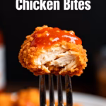 ingredients image of a visually appealing flat lay of fresh raw chicken breast cut into bite sized pieces measuring spoons and fresh garlic cloves with bottles of buffalo sauce and olive oil a bowl of cornstarch blue cheese crumbles chopped celery and fresh parsley ready for making delicious air fryer buffalo chicken bites