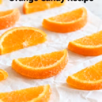 image of a top down mise en place shot showing fresh oranges navel tangelos blood oranges granulated sugar water and cinnamon sticks arranged on a white marble kitchen counter with healthy clear glass bowls and rustic brown wooden kitchen sets under soft diffuse daylight