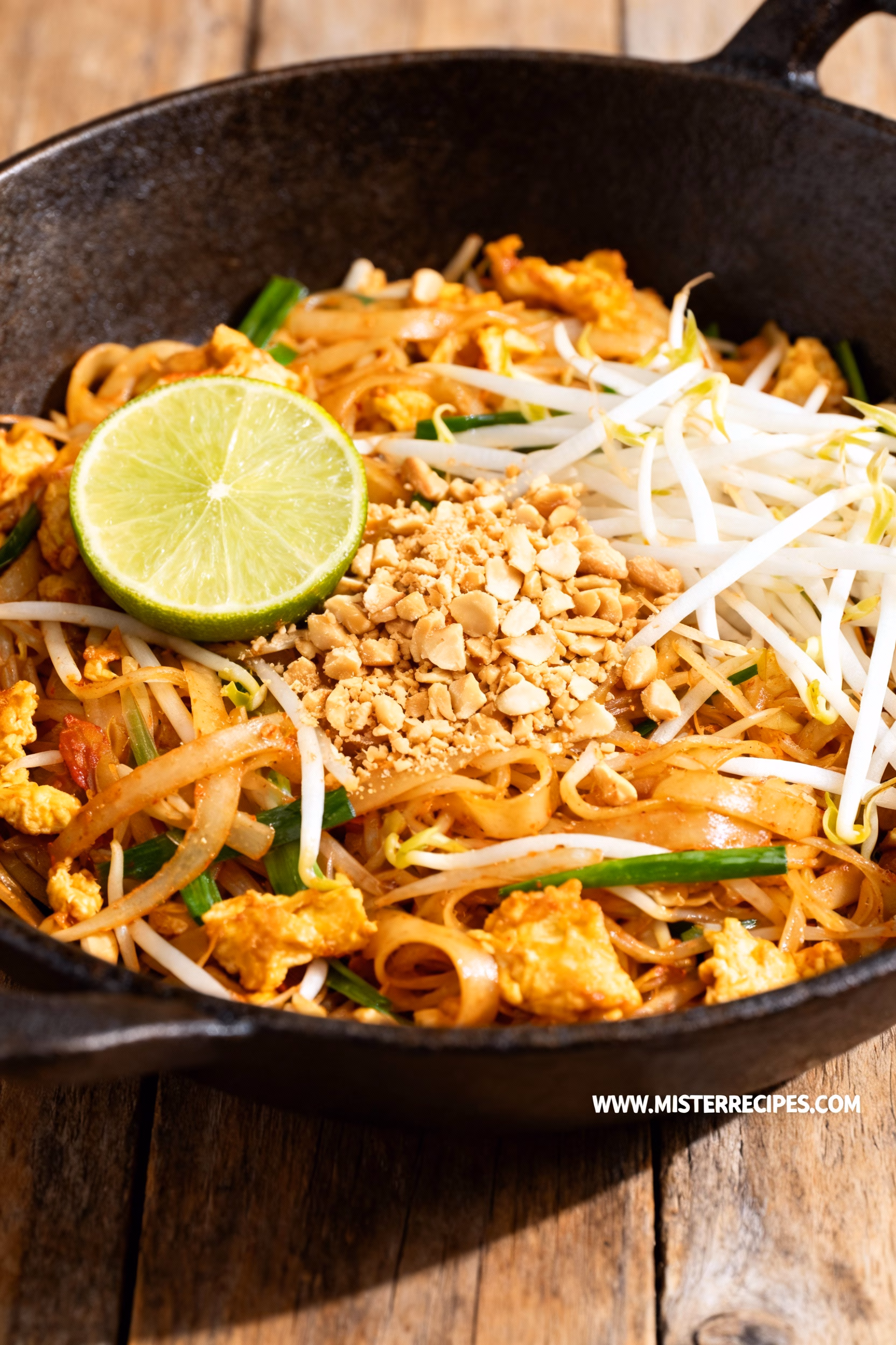 image of thin rice noodles fish sauce tamarind paste soy sauce brown sugar eggs chicken breast shrimp tofu beef pork garlic shallots green onions fresh bean sprouts carrots oyster sauce peanut butter sriracha red pepper flakes peanut oil sesame oil lime juice preserved radish Chinese garlic chives fresh cilantro roasted peanuts coconut oil avocado oil water arranged on white marble kitchen counter with clear glass bowls and rustic brown wooden kitchen sets under soft diffuse daylight