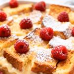 image of stale brioche bread eggs whole milk brown sugar butter ground cinnamon vanilla extract nutmeg salt maple syrup powdered sugar fresh berries arranged on a white marble kitchen counter in healthy clear glass bowls and rustic brown wooden kitchen sets under soft diffuse daylight in a realistic top down mise en place shot