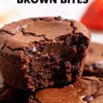 image of a realistic top down mise en place shot showing the fresh ingredients brownie mix or flour cocoa powder butter sugar eggs chocolate chips vanilla extract salt mms marshmallows heart sprinkles pink icing arranged on a white marble kitchen counter with healthy clear glass bowls and rustic brown wooden kitchen sets under soft diffuse daylight